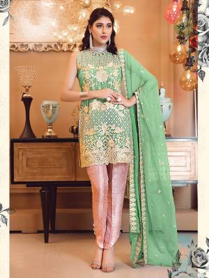 Look Attractive In This Heavy Embroidered Designer Suit In Green Colored Top And Dupatta Paired With Contrasting Pink Colored Bottom. Its Top Is Fabricated On Georgette Paired With Jacquard Silk Bottom And Chiffon Dupatta. 