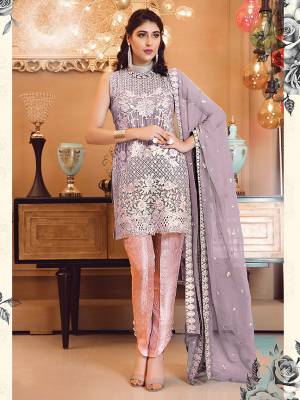 Look Attractive In This Heavy Embroidered Designer Suit In Purple Colored Top And Dupatta Paired With Contrasting Pink Colored Bottom. Its Top Is Fabricated On Georgette Paired With Jacquard Silk Bottom And Chiffon Dupatta. 
