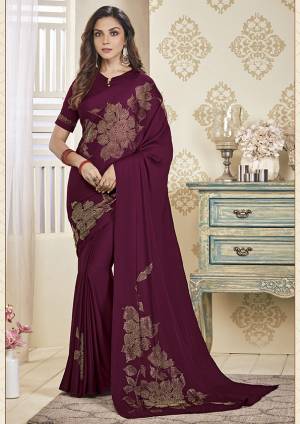 Adorn The Pretty Angelic Look Wearing This Designer Elegant Looking Saree In Wine Color. This Pretty Saree And Blouse Are Fabricated On Soft Satin Beautified With Pretty Stone Work. Its Lovely Color And Stone Work Will Definitely Earn You Lots Of Compliments From Onlookers. 