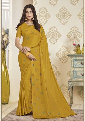 Adorn The Pretty Angelic Look Wearing This Designer Elegant Looking Saree In Musturd Yellow Color. This Pretty Saree And Blouse Are Fabricated On Soft Satin Beautified With Pretty Stone Work. Its Lovely Color And Stone Work Will Definitely Earn You Lots Of Compliments From Onlookers. 