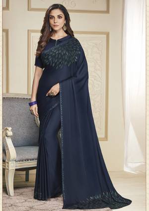Adorn The Pretty Angelic Look Wearing This Designer Elegant Looking Saree In Navy Blue Color. This Pretty Saree And Blouse Are Fabricated On Soft Satin Beautified With Pretty Stone Work. Its Lovely Color And Stone Work Will Definitely Earn You Lots Of Compliments From Onlookers. 