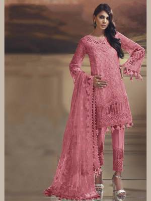 Grab This Pretty Straight Suit In Pink Color Paired With Pink Colored Bottom And Dupatta. Its Top Is Fabricated On Tissue Silk Paired With Santoon Bottom And Net Fabricated Dupatta. Buy This Suit Now.