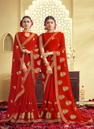 Adorn The Pretty Angelic Look Wearing This Designer Saree In Red Color Paired With Red Colored Blouse. This Saree And Blouse Are Fabricated On Georgette Beautified With Jari Embroidery. Buy Now.