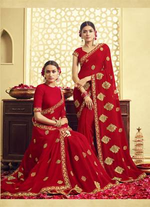 Adorn The Pretty Angelic Look Wearing This Designer Saree In Red Color Paired With Red Colored Blouse. This Saree And Blouse Are Fabricated On Georgette Beautified With Jari Embroidery. Buy Now.