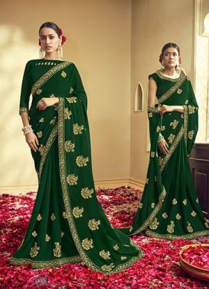 Catch All The Limelight Wearing This Pretty Designer Saree In Dark Green Color. This Saree And Blouse Are Georgette Based Beautified With Attractive Jari Work. Buy This Pretty Saree Now. 