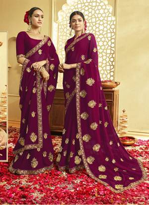 Catch All The Limelight Wearing This Pretty Designer Saree In Wine Color. This Saree And Blouse Are Georgette Based Beautified With Attractive Jari Work. Buy This Pretty Saree Now. 