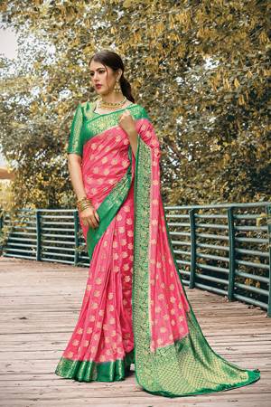 Adorn A Proper Traditional Look In This Designer Weaved Saree In Pink Color Paired With Green Colored Blouse. This Saree And Blouse Are Nylon Silk Based Beautified With Weave. 