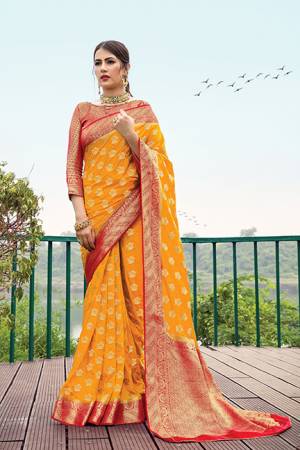 Adorn A Proper Traditional Look In This Designer Weaved Saree In Musturd Yellow Color Paired With Red Colored Blouse. This Saree And Blouse Are Nylon Silk Based Beautified With Weave. 