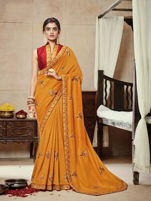 Celebrate This Festive Season With Beauty And Comfort Wearing This Lovely Musturd Yellow Colored Saree Paired With Red Colored Blouse.  This Saree Is Satin Silk Based Paired With Art Silk Fabricated Blouse. Buy Now.