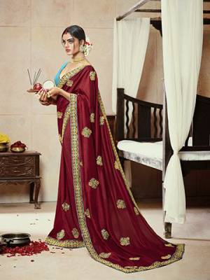 Celebrate This Festive Season With Beauty And Comfort Wearing This Lovely Maroon Colored Saree Paired With Sky Blue Colored Blouse.  This Saree Is Satin Silk Based Paired With Art Silk Fabricated Blouse. Buy Now.