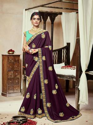 Add This Very Pretty Attractive Looking Designer Saree To Your Wardrobe In Wine Color Paired With Contrasting Sea Green Colored Blouse. This Saree Is Fabricated On Satin Silk Paired With Art Silk Fabricated Blouse. 