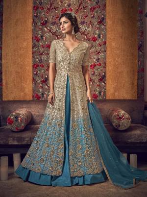 Shaded Dress Can Never go Out Of Style, So Grab This Very Pretty Shaded Designer Indo-Western Suit In Cream And Blue Color. Its Pretty Top Is Fabricated On Net Paired With Art Silk Fabricated Skirt And A Pant With Net Fabricated Dupatta. Also It Has Pretty Cream And Blue Colored Shaded Inner Fabricated On Satin. 