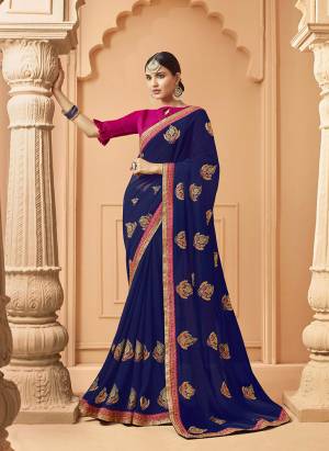 Catch All The Limelight At The Next Function You Attend In This Very Pretty Designer saree In Royal Blue Color Paired With Contrasting Dark Pink Colored Blouse. It Is Beautified With Embroidered Motifs Giving An Elegant Look. Buy  This Saree Now.