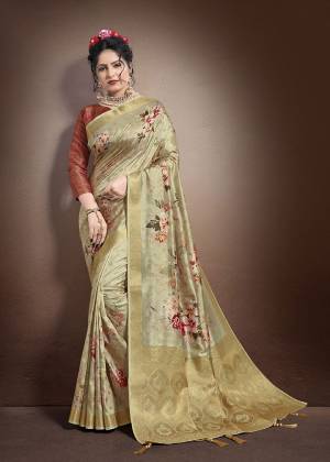 Grab This Lovely Floral Printed Designer Saree In Beige Color Paired With Rust Orange Colored Blouse. This Saree And Blouse Are Fabricated On Jacquard Silk Beautified With Weave And Digital Prints. It Is Light In Weight And Easy To Carry All Day Long. 