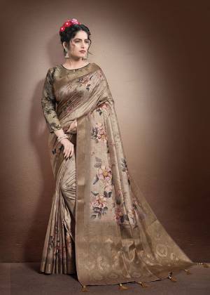 You Will Definitely Earn Lots Of Compliments Wearing This Designer Saree In Light Brown Color Paired With Grey Colored Blouse. This Saree and Blouse Are Fabricated On Jacquard Silk Beautified With Weave And Digital Print. Buy Now.