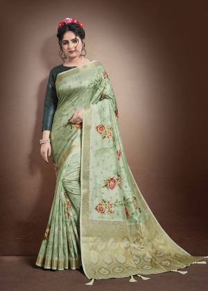 Grab This Lovely Floral Printed Designer Saree In Sea Green Color Paired With Teal Blue Colored Blouse. This Saree And Blouse Are Fabricated On Jacquard Silk Beautified With Weave And Digital Prints. It Is Light In Weight And Easy To Carry All Day Long. 