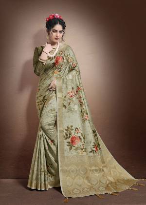 You Will Definitely Earn Lots Of Compliments Wearing This Designer Saree In Light Olive Green Color Paired With Olive Green Colored Blouse. This Saree and Blouse Are Fabricated On Jacquard Silk Beautified With Weave And Digital Print. Buy Now.