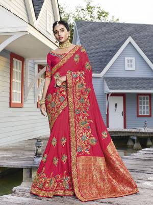 Get Ready For The Upcoming Wedding Season With This Heavy Designer Saree In Dark Pink Color. This Pretty Heavy Embroidered Saree Is Fabricated On Satin Silk Paired With Art Silk Fabricated Blouse. It Has Very Pretty Detailed Embroidery Giving An Attractive Look. 
