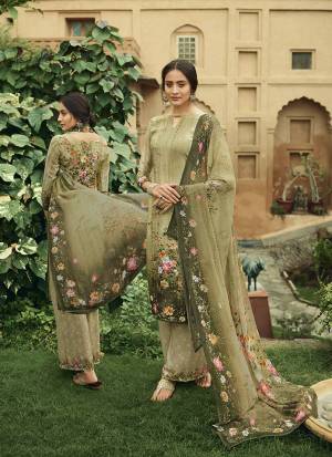 Here Is A Pretty Elegant Looking Designer Straight Suit In Olive Green Color. Its Top and Bottom Are Crepe Based Paired With Georgette Fabricated Dupatta. It Is Beautified With Digital Prints All Over. 