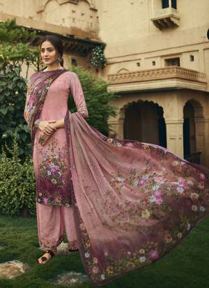 Here Is A Pretty Elegant Looking Designer Straight Suit In Pink Color. Its Top and Bottom Are Crepe Based Paired With Georgette Fabricated Dupatta. It Is Beautified With Digital Prints All Over. 