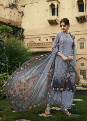 Here Is A Pretty Elegant Looking Designer Straight Suit In Grey Color. Its Top and Bottom Are Crepe Based Paired With Georgette Fabricated Dupatta. It Is Beautified With Digital Prints All Over. 