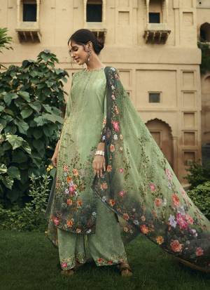 Here Is A Pretty Elegant Looking Designer Straight Suit In Green Color. Its Top and Bottom Are Crepe Based Paired With Georgette Fabricated Dupatta. It Is Beautified With Digital Prints All Over. 