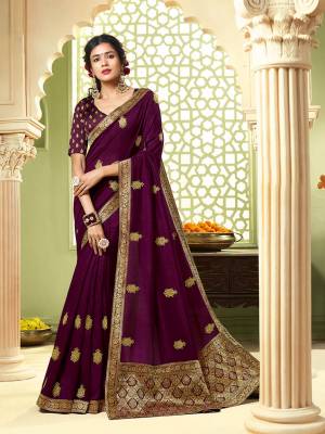 Celebrate This Festive Season With Beauty And Comfort Wearing This Designer Saree In Wine Color. This Pretty Saree Is Fabricated On Art Silk Paired With Jacquard Silk Fabricated Blouse. It Is Beautified With Jari Embroidery And Stone Work. 