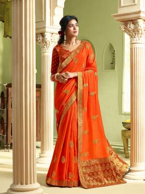 Flaunt Your Rich And Elegant Taste Wearing This Pretty Saree In Orange Color. This Saree and Blouse Are Silk Based Which Gives A Rich Look To Your Personality, Buy Now.