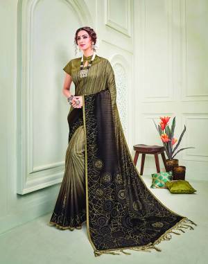 Drip into the auspiciousness and beauty like that of gold in this earthy two-shade saree in abstract metallic foil details and look precious. 