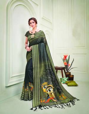 Look like an epitome of heritage and traditional beauty in this olive-green and black shaded silk saree  with kalamkari inpisred print and kantha details. 