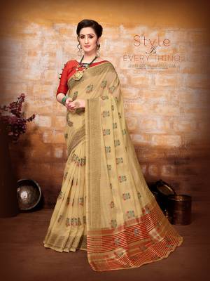 Flaunt Your Rich And Elegant Taste Wearing This Designer Saree In Cream Color Paired With Orange Colored Blouse. This Saree And Blouse are Fabricated On Art Silk Beautified With Pretty Weave. 