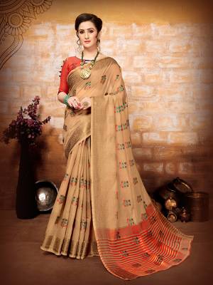 Flaunt Your Rich And Elegant Taste Wearing This Designer Saree In Beige Color Paired With Orange Colored Blouse. This Saree And Blouse are Fabricated On Art Silk Beautified With Pretty Weave. 