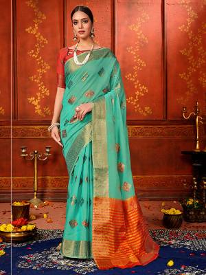 Look Pretty In This Designer Silk Based Saree In Sea Blue Color Paired With Orange Colored Blouse. This Saree And Blouse Are Fabricated On Art Silk Beautified With Weave. It Is Light In Weight And Easy To Carry All Day Long. 