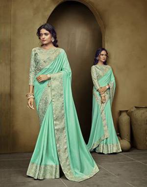 Simple and Elegant Looking Saree Is Here In Sea Green Color. This Plain Saree Has Weaved Broad Border. This Saree Is Fabricated On Art Silk Paired With Brocade Fabricated Blouse. Buy Now. 