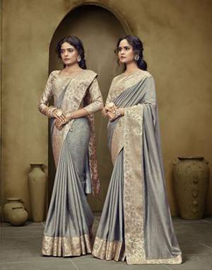 Simple and Elegant Looking Saree Is Here In Grey Color. This Plain Saree Has Weaved Broad Border. This Saree Is Fabricated On Art Silk Paired With Brocade Fabricated Blouse. Buy Now. 
