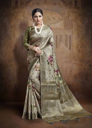 Flaunt Your Rich And Elegant Taste Wearing This Designer Saree In Grey Color Paired With Olive Green Colored Blouse. This Saree And Blouse Are Fabricated On Jacquard Silk Beautified With Weave All Over. 
