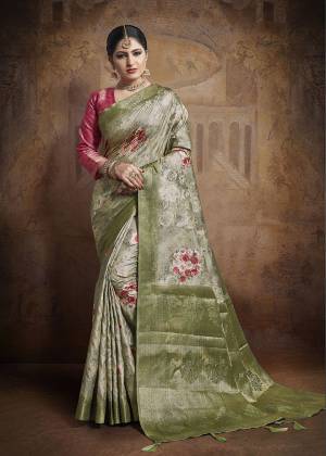 Celebrate This Festive Season In This Very Beautiful And Attractive Looking Designer Saree In Light Green Color Paired With Contrasting Dark Pink Colored Blouse. This Saree and Blouse Are Fabricated On Jacquard Silk Beautified With Weave All Over. Buy This Saree Now.