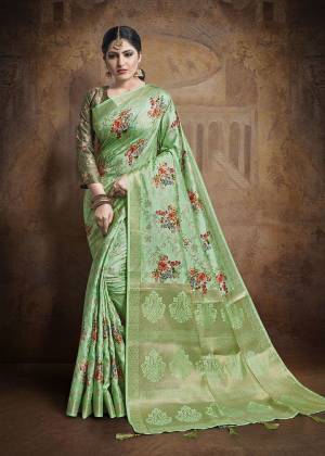 Flaunt Your Rich And Elegant Taste Wearing This Designer Saree In Light Green Color Paired With Dark Green Colored Blouse. This Saree And Blouse Are Fabricated On Jacquard Silk Beautified With Weave All Over. 