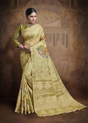 Flaunt Your Rich And Elegant Taste Wearing This Designer Saree In Light Yellow Color Paired With Green Colored Blouse. This Saree And Blouse Are Fabricated On Jacquard Silk Beautified With Weave All Over. 