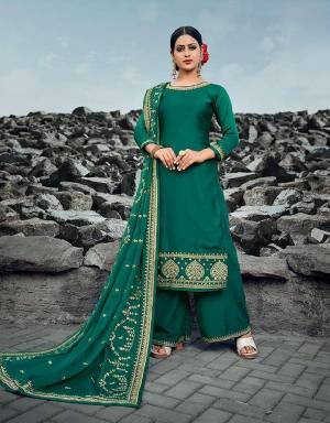 Grab This Beautiful Designer Heavy Straight Suit In Teal Green Color. Its Top Is Fabricated On Satin Georgette Paired With Art Silk Bottom And Silk Georgette Dupatta. Buy This Pretty Suit Now.