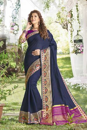 Simple And Elegant Looking Pretty Saree Is Here In Navy Blue Color Paired With Purple Colored Blouse. This Saree And Blouse Are Fabricated On Khadi Silk Beautified With Weave Over The Saree Border. 