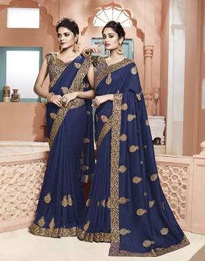 Grab This Pretty Designer Saree In Navy Blue Color. This Saree Is Silk Based Paired With Brocade Fabricated Blouse. Its Fabric And Color Gives A Rich Look To Your Personality. 