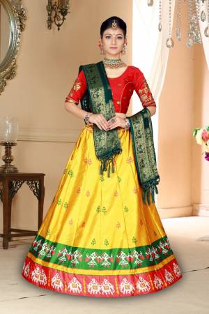 Go Colorful Wearing This Designer Silk Based Lehenga In Red, Yellow And Dark Green Color. Its Pretty Blouse And Lehenga Are Fabricated On Satin Silk Paired With Bandhani Silk Dupatta. Its Fabric Is Durable, Light Weight And Easy To Carry Throughout The Gala. 