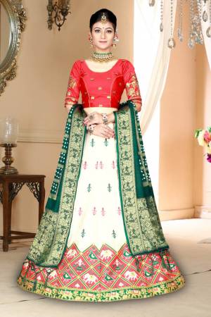 Go Colorful Wearing This Designer Silk Based Lehenga In Dark Pink, White And Dark Green Color. Its Pretty Blouse And Lehenga Are Fabricated On Satin Silk Paired With Bandhani Silk Dupatta. Its Fabric Is Durable, Light Weight And Easy To Carry Throughout The Gala. 