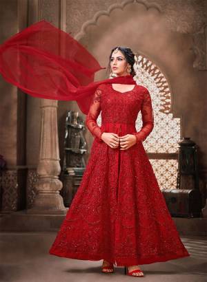 Adorn The Pretty Angelic Look Wearing This Heavy Designer Indo Western Suit In Red Color. Its Top And Dupatta Are Fabricated On Net Paired With Santoon Bottom.