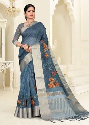 You Will Definitely Earn Lots Of Compliments Wearing This Designer Saree In Dark Grey Color. This Saree Is Orgenza Based Beautified With Floral Prints. Buy This Saree Now.