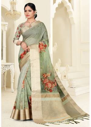 Add This Lovely Saree To Your Wardrobe In Pastel Green Color, This Pretty  Saree Is Orgenza Based Beautified With Pretty Floral Prints. 