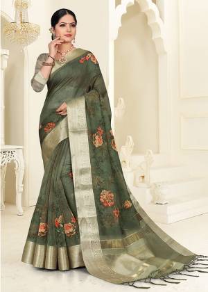 Flaunt Your Rich And Elegant Taste Wearing This Lovely Floral Printed Designer Saree In Dark Green Color. This Pretty Saree Is Fabricated On Orgenza Which Also Gives An Elegant Look To Your Personality. 