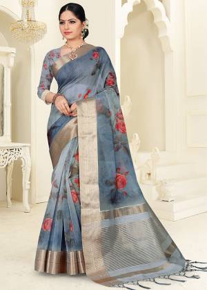 Add This Lovely Saree To Your Wardrobe In Steel Blue Color, This Pretty  Saree Is Orgenza Based Beautified With Pretty Floral Prints. 