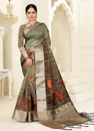 Celebrate This Festive Season With Beauty And Comfort Wearing This Printed Saree In Olive Green color. This Saree Is Fabricated On Orgenza Which Is Light Weight And Easy To Carry Throughout The Gala.